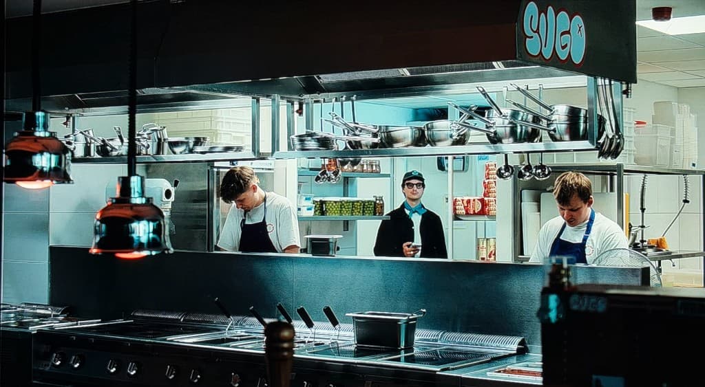 Professional kitchen with chefs and team at work
